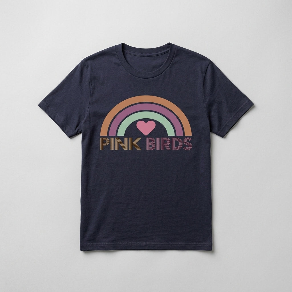 A navy blue short-sleeve t-shirt with a retro-style rainbow graphic and the text 'PINK BIRDS' printed on the chest, displayed flat against a light gray background.